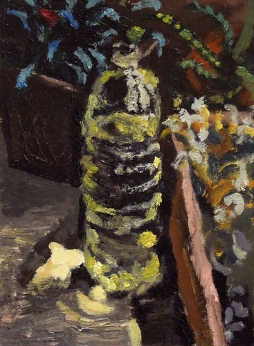 A bottle with water by the flowerpots